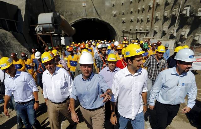 Rio de Janeiro's Mayor Paes and Rio de Janeiro's Governor Pezao leave one of the two tunnels on the Transolimpica freeway route, which will connect the Rio 2016 Olympic Park and the Deodoro Sports Complex, in Rio de Janeiro